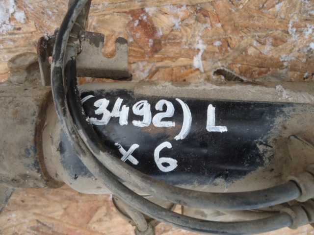 Амортизатор передний левый