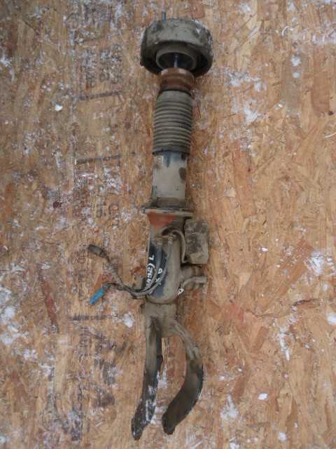 Амортизатор передний левый