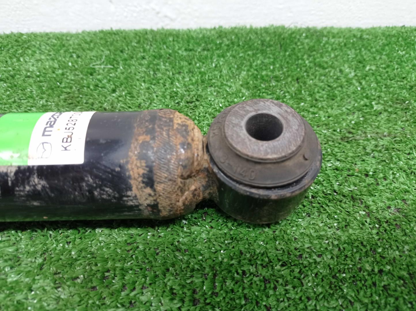 Амортизатор задний левый