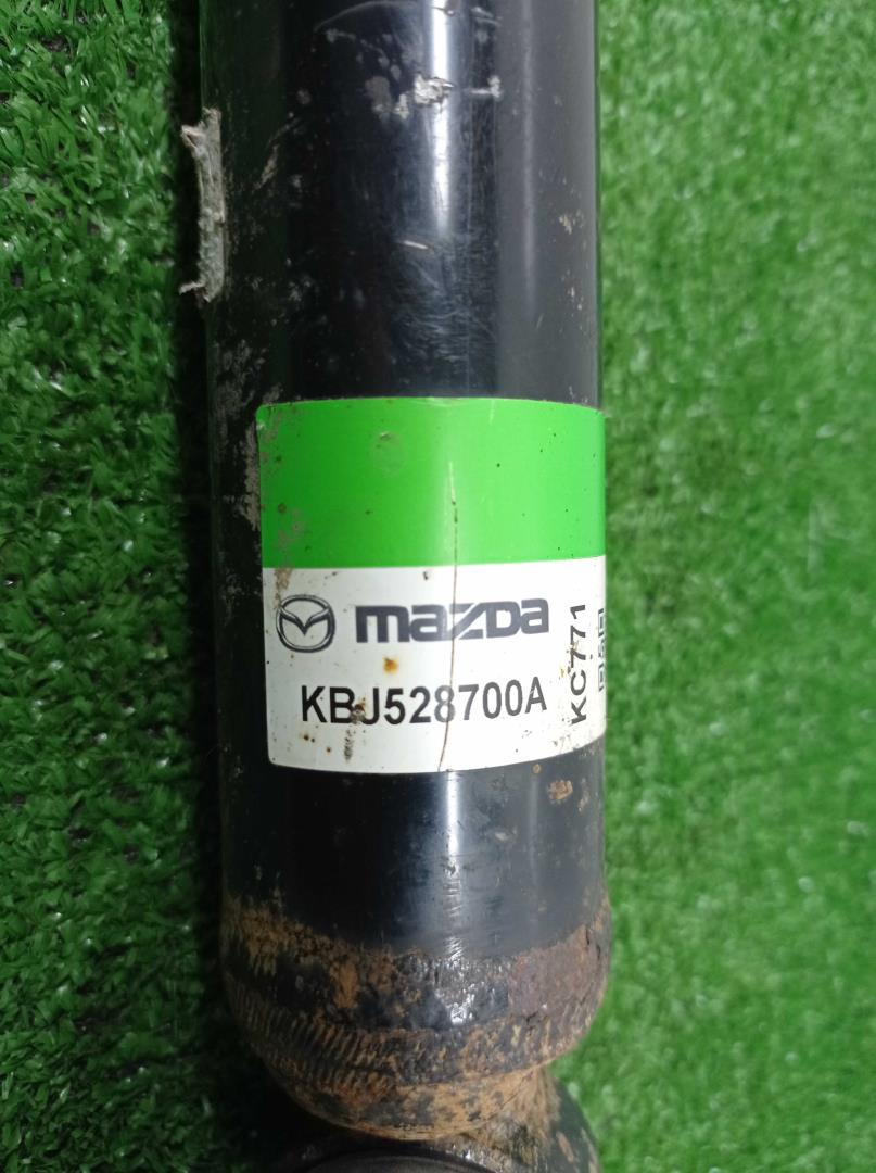 Амортизатор задний левый