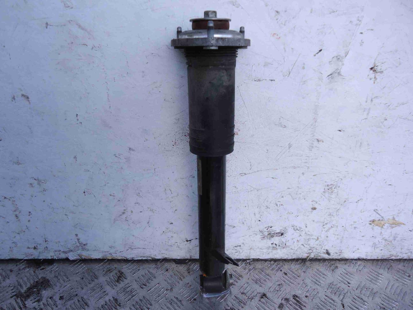 Амортизатор задний левый