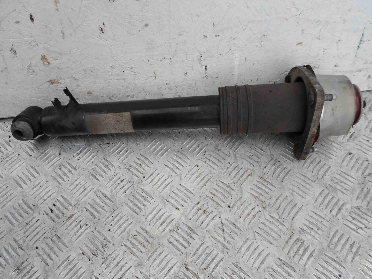 Амортизатор задний левый