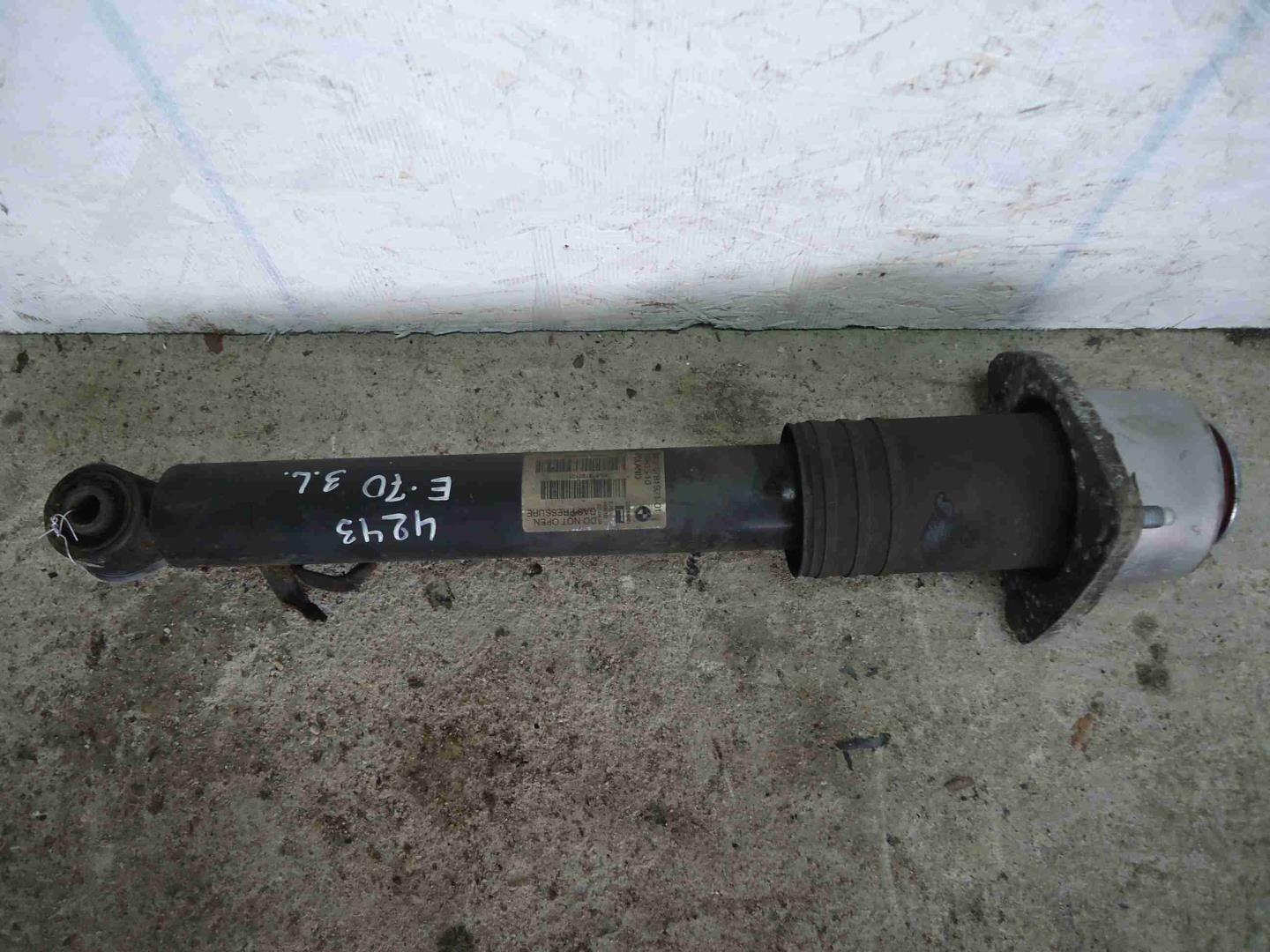 Амортизатор задний левый
