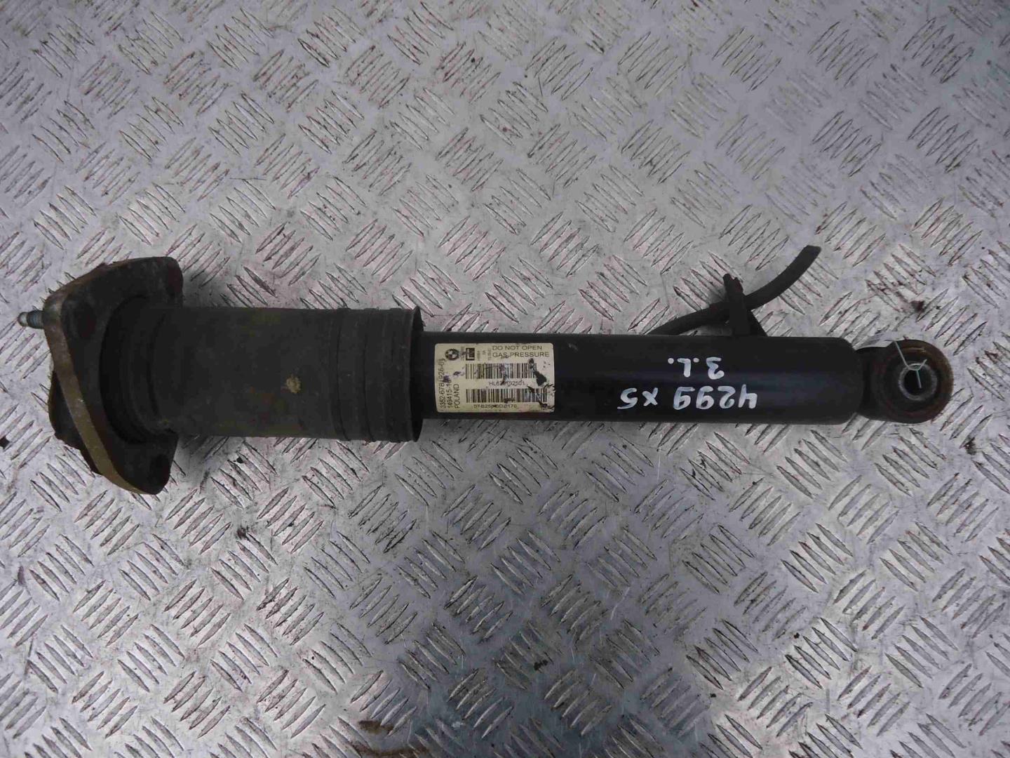 Амортизатор задний левый