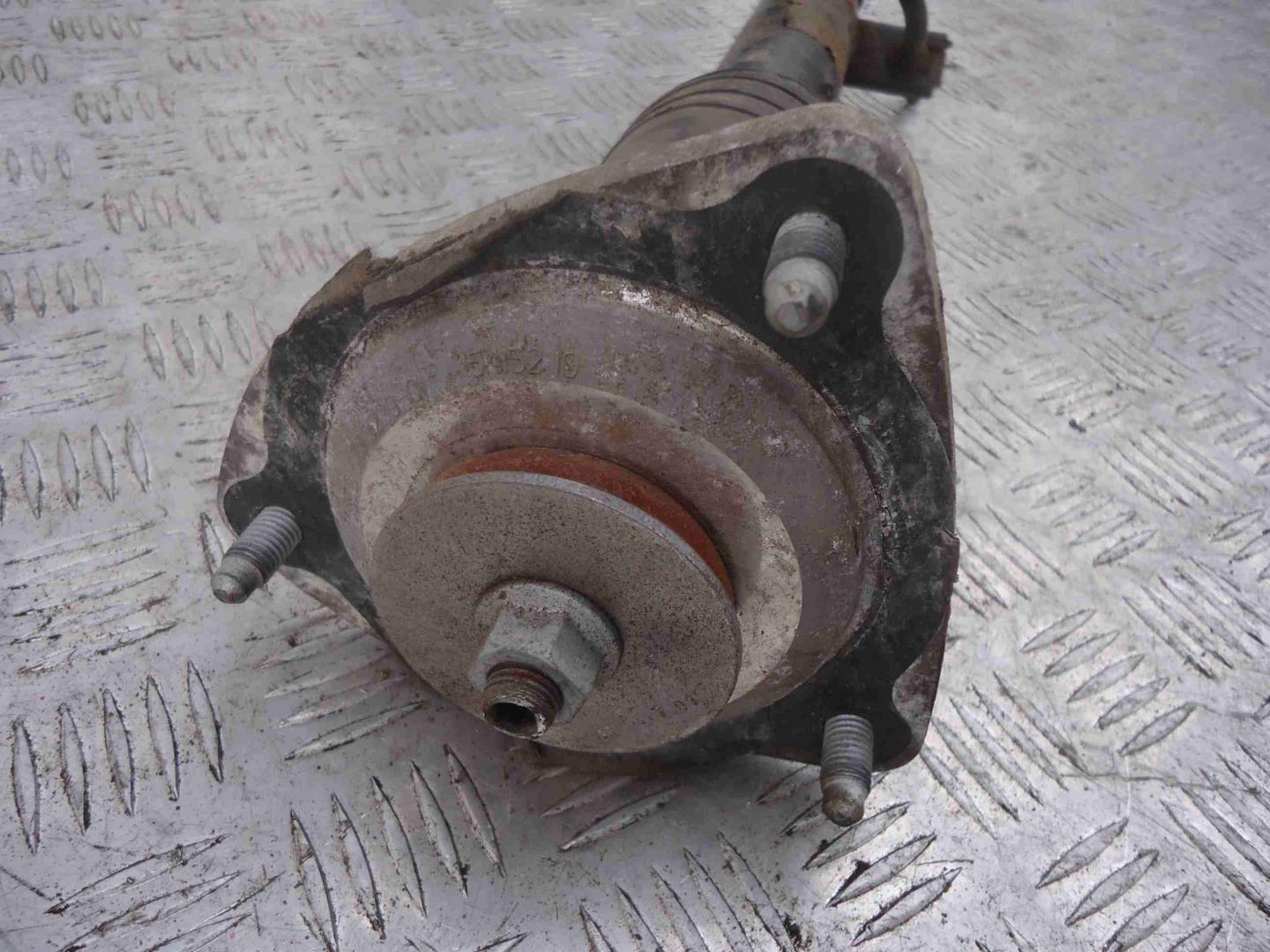 Амортизатор задний левый