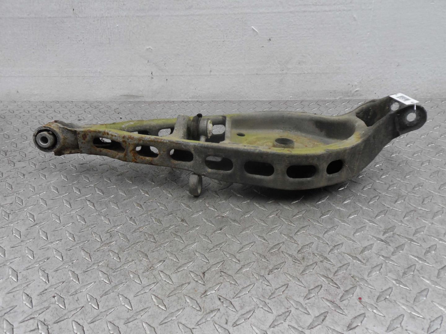 Рычаг задний левый