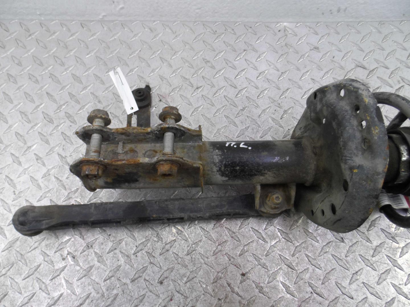 Амортизатор передний левый