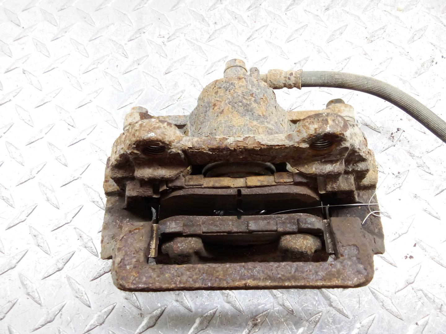 Суппорт задний левый