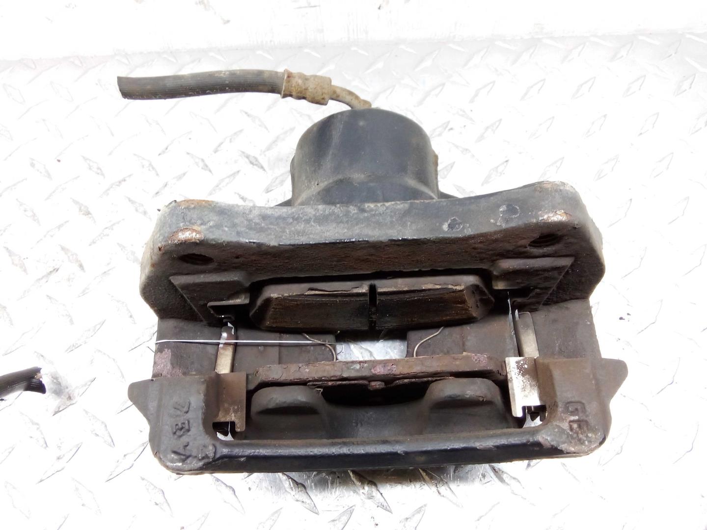 Суппорт передний левый