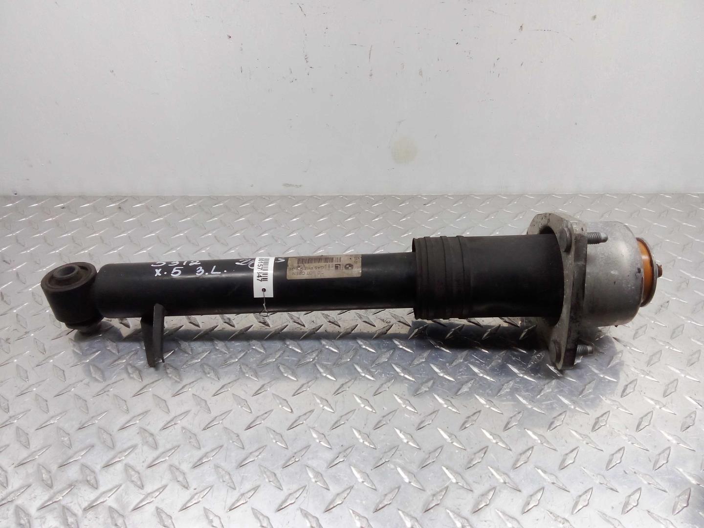 Амортизатор задний левый