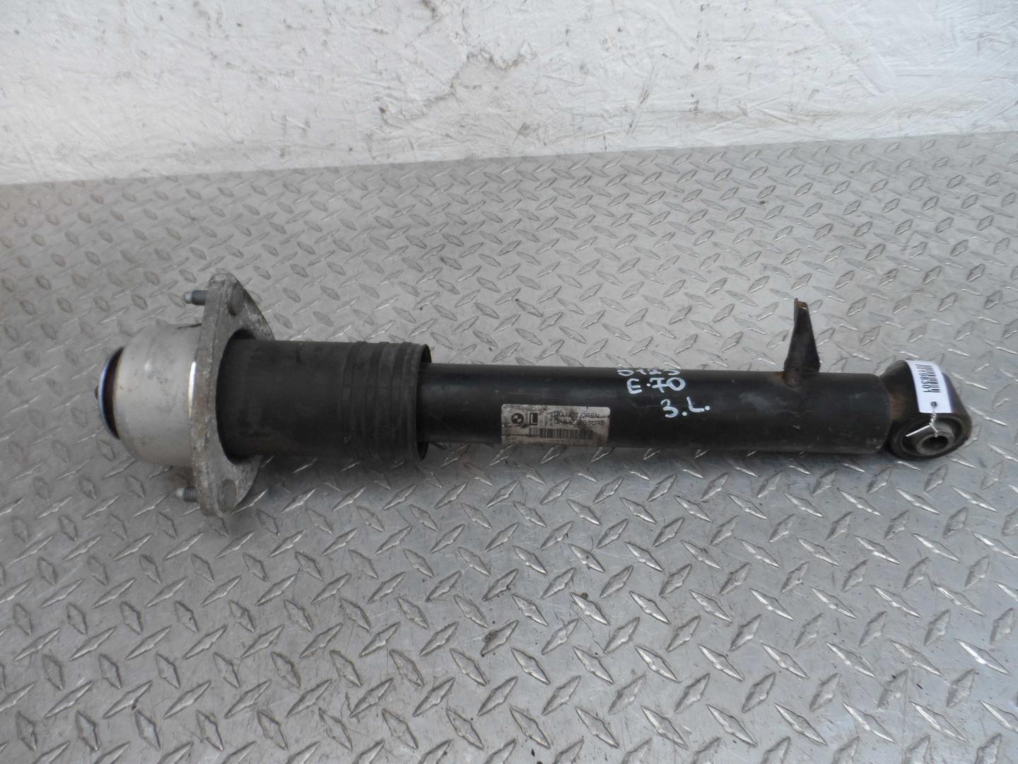 Амортизатор задний левый