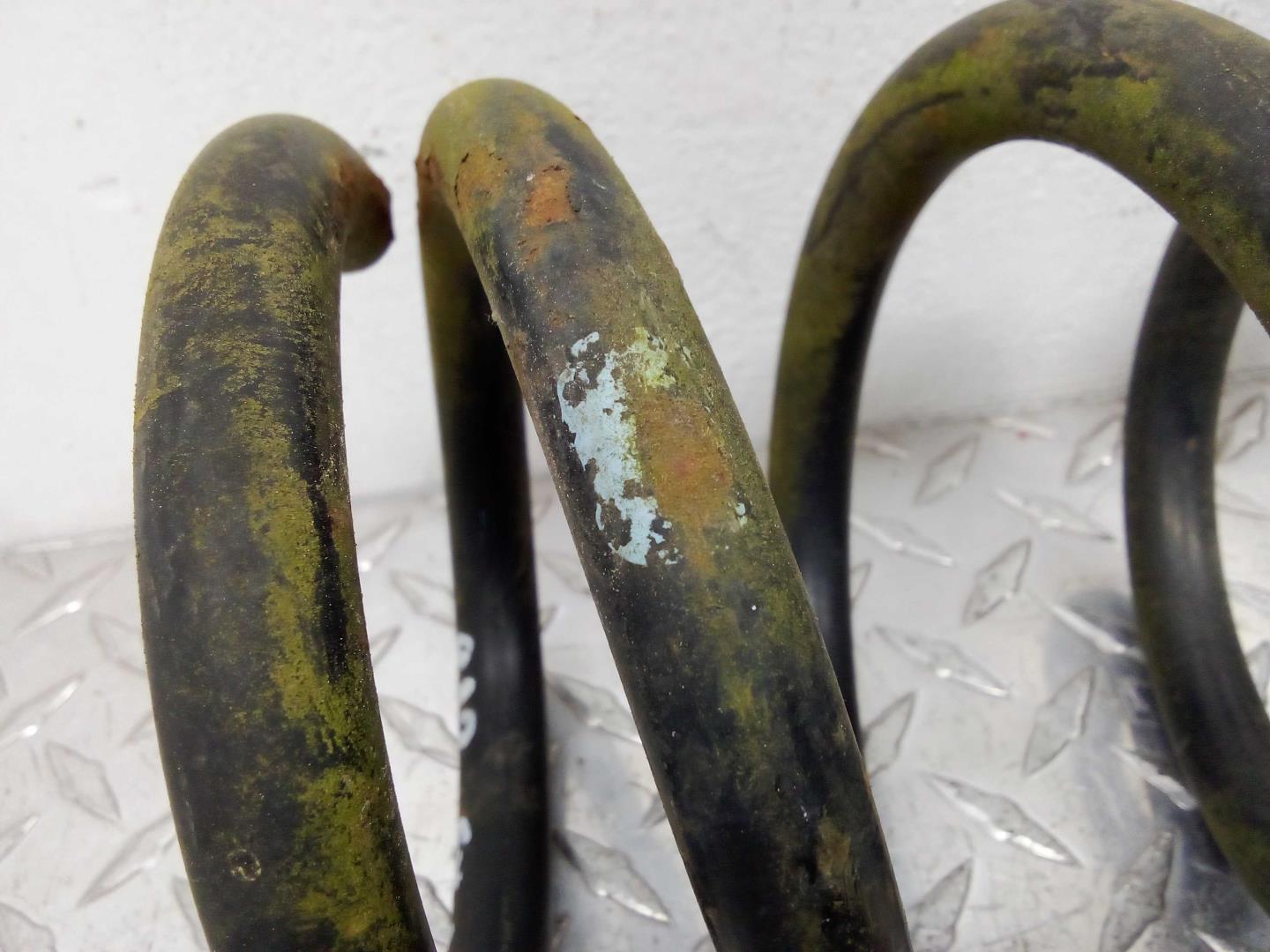 Пружина задняя