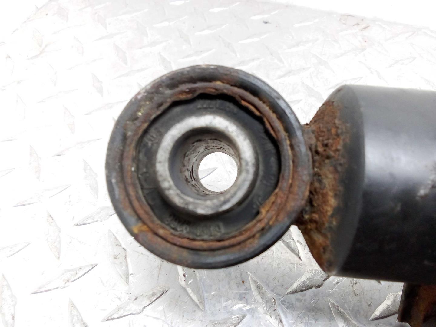 Амортизатор задний левый