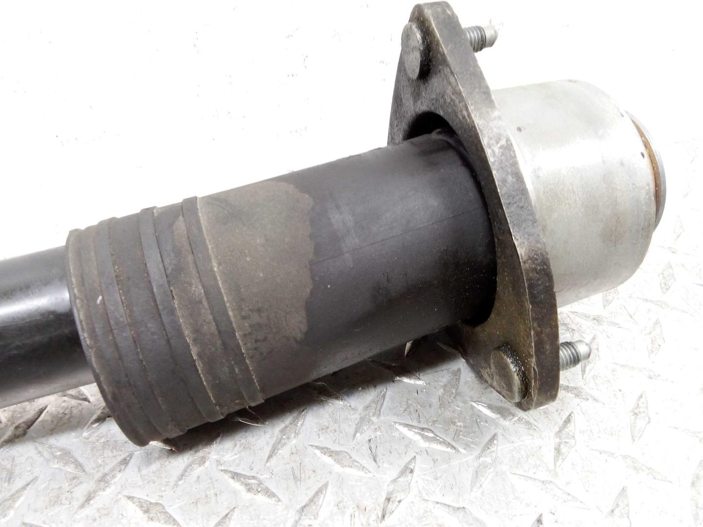 Амортизатор задний левый