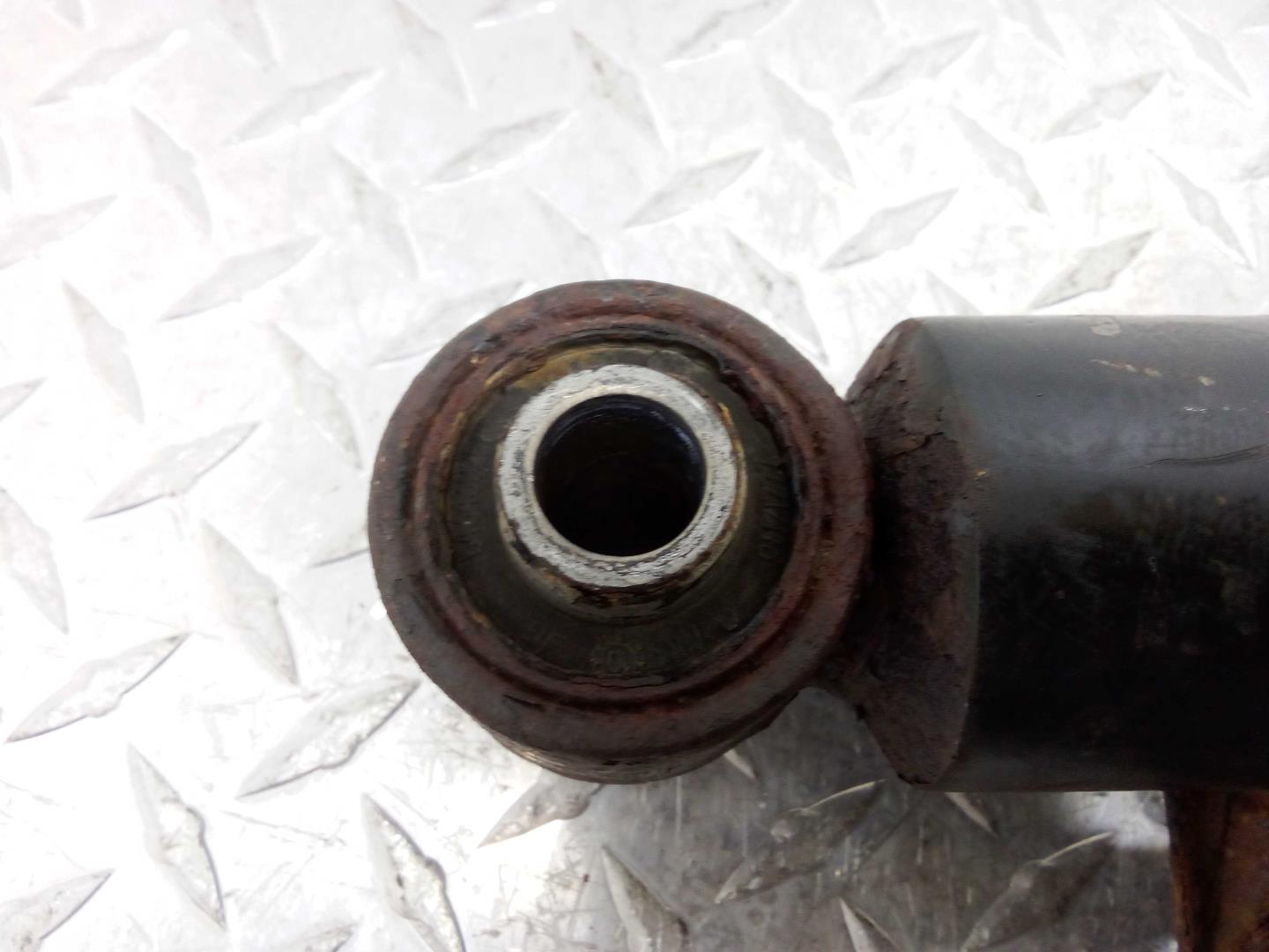 Амортизатор задний левый