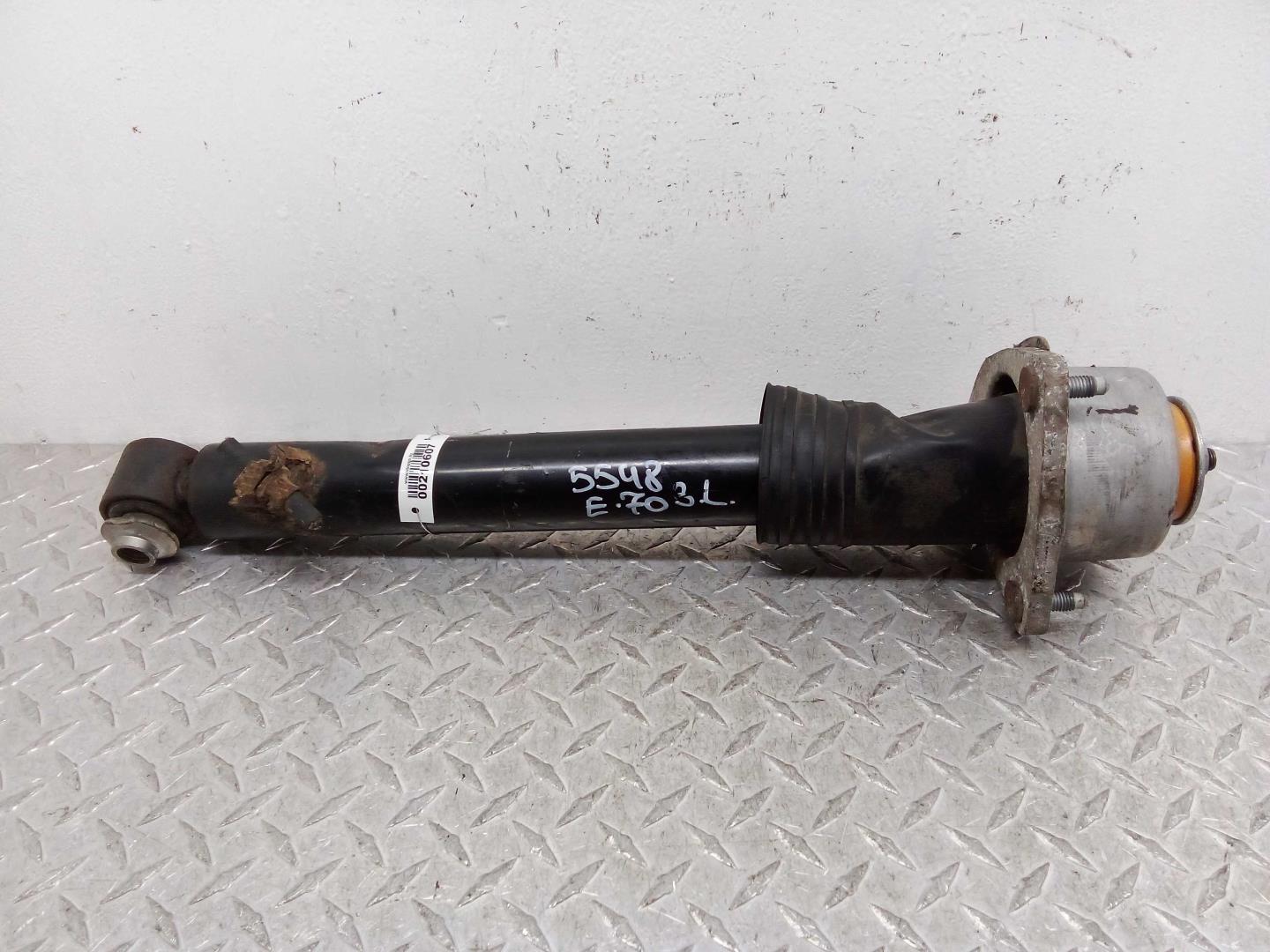 Амортизатор задний левый