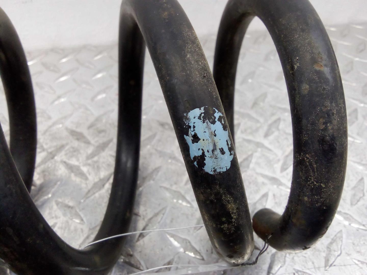 Пружина задняя