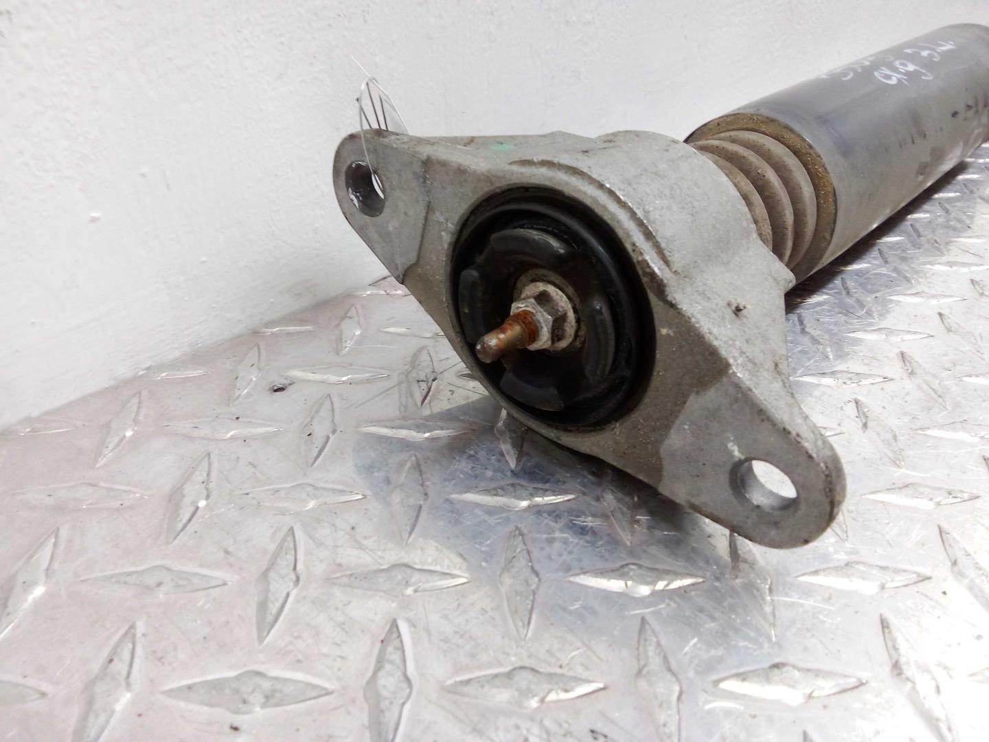 Амортизатор задний левый