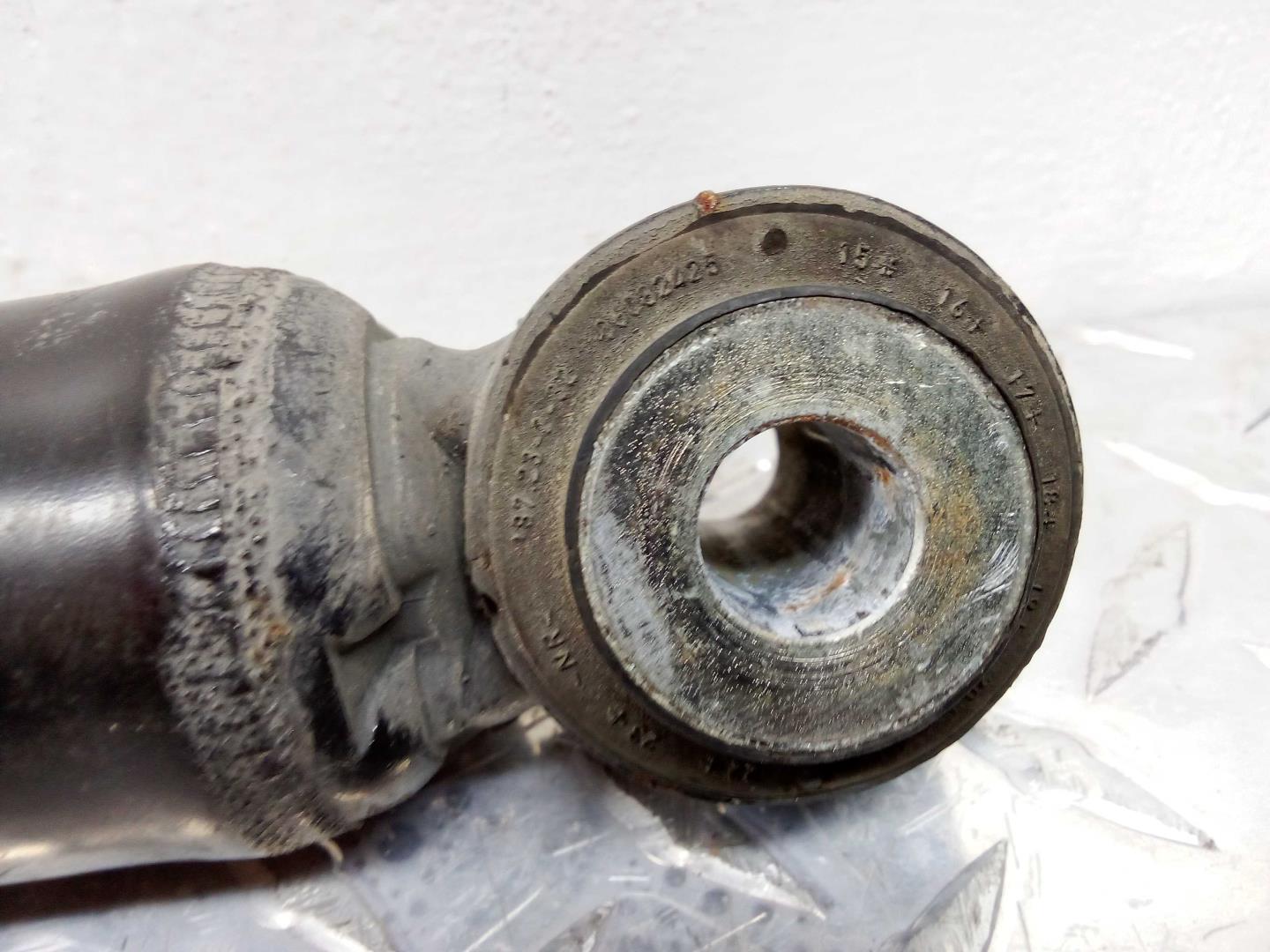 Амортизатор задний левый