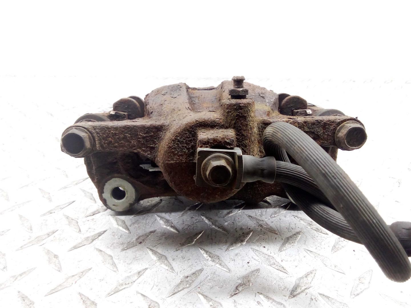 Суппорт задний левый