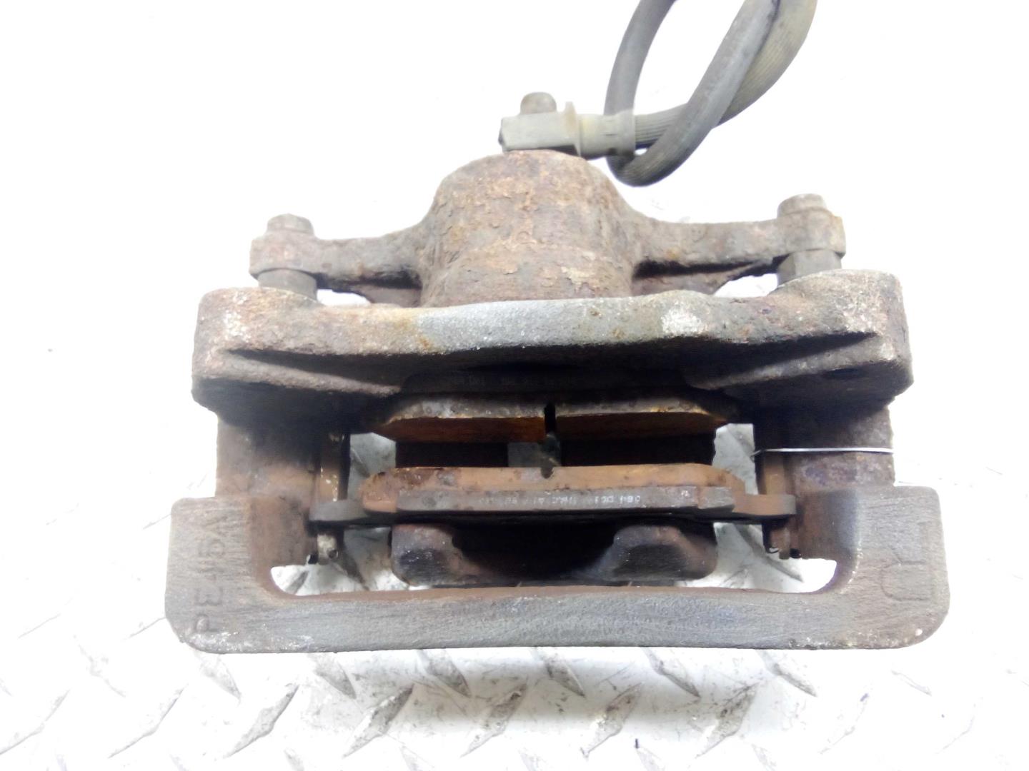 Суппорт задний левый