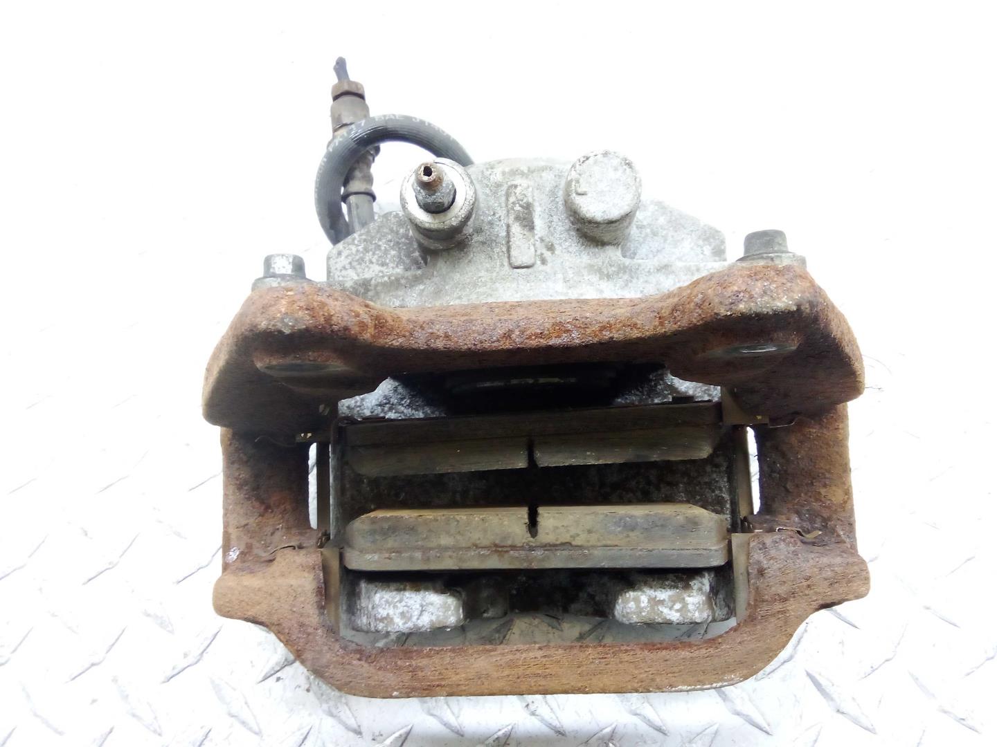 Суппорт задний левый