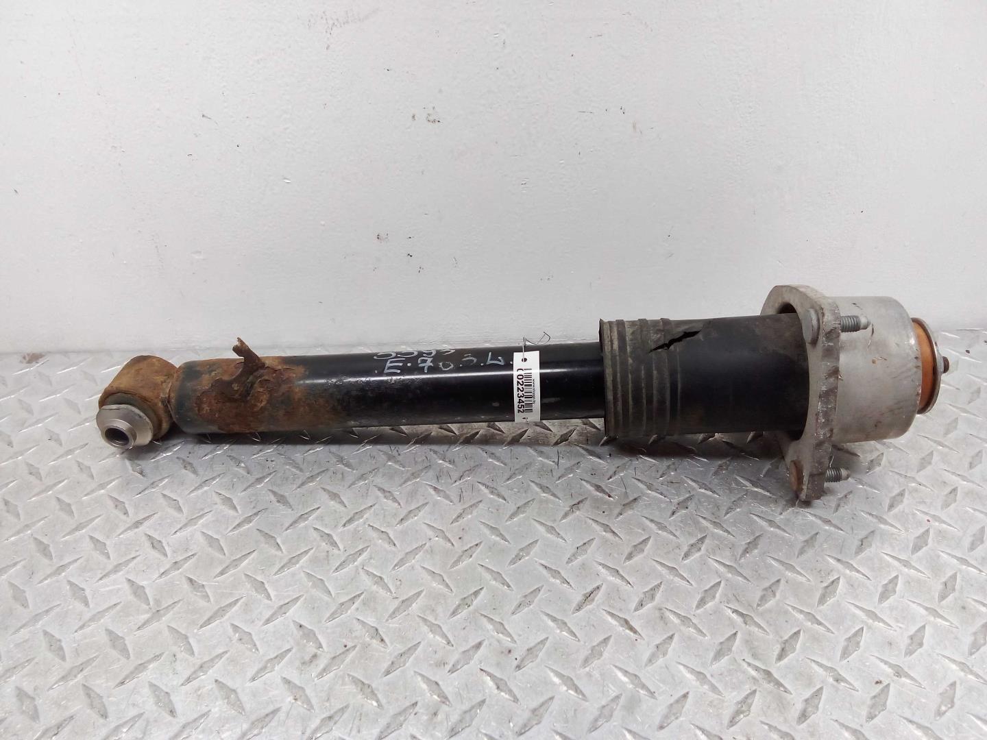 Амортизатор задний левый