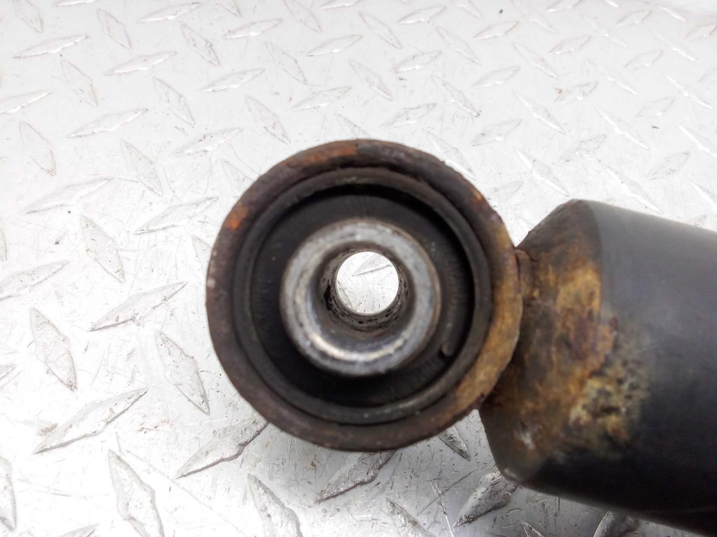 Амортизатор задний левый