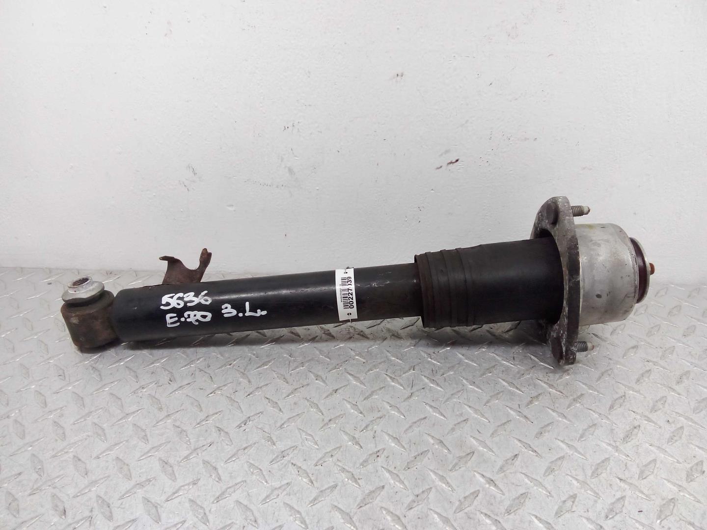 Амортизатор задний левый