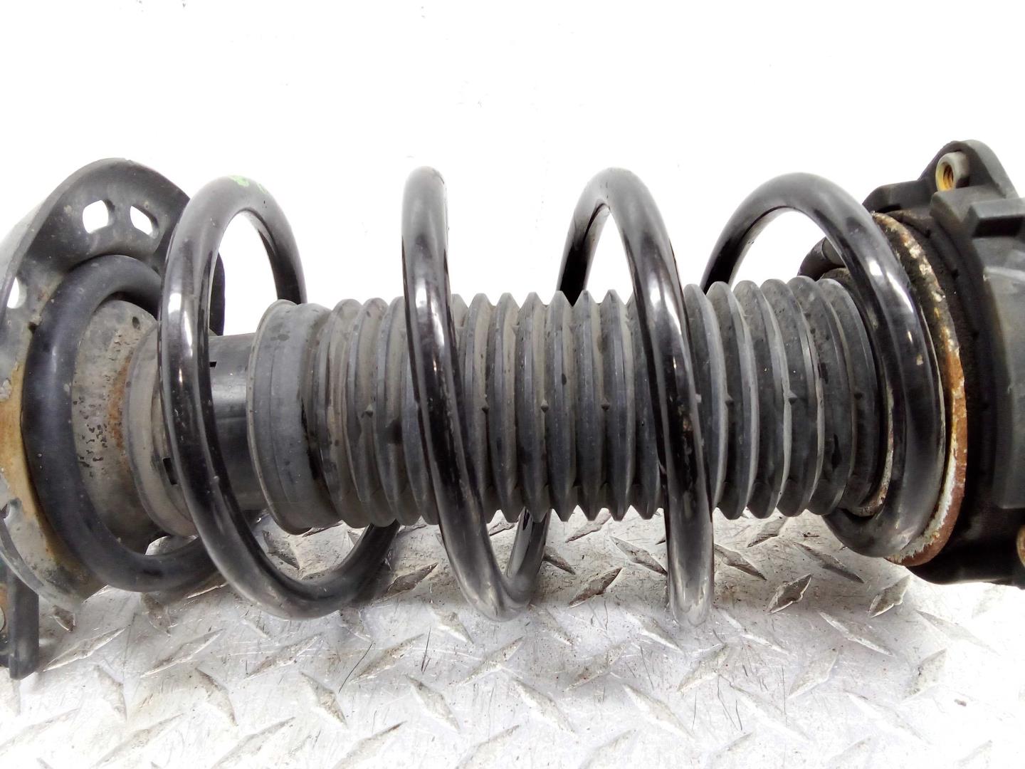 Амортизатор передний левый