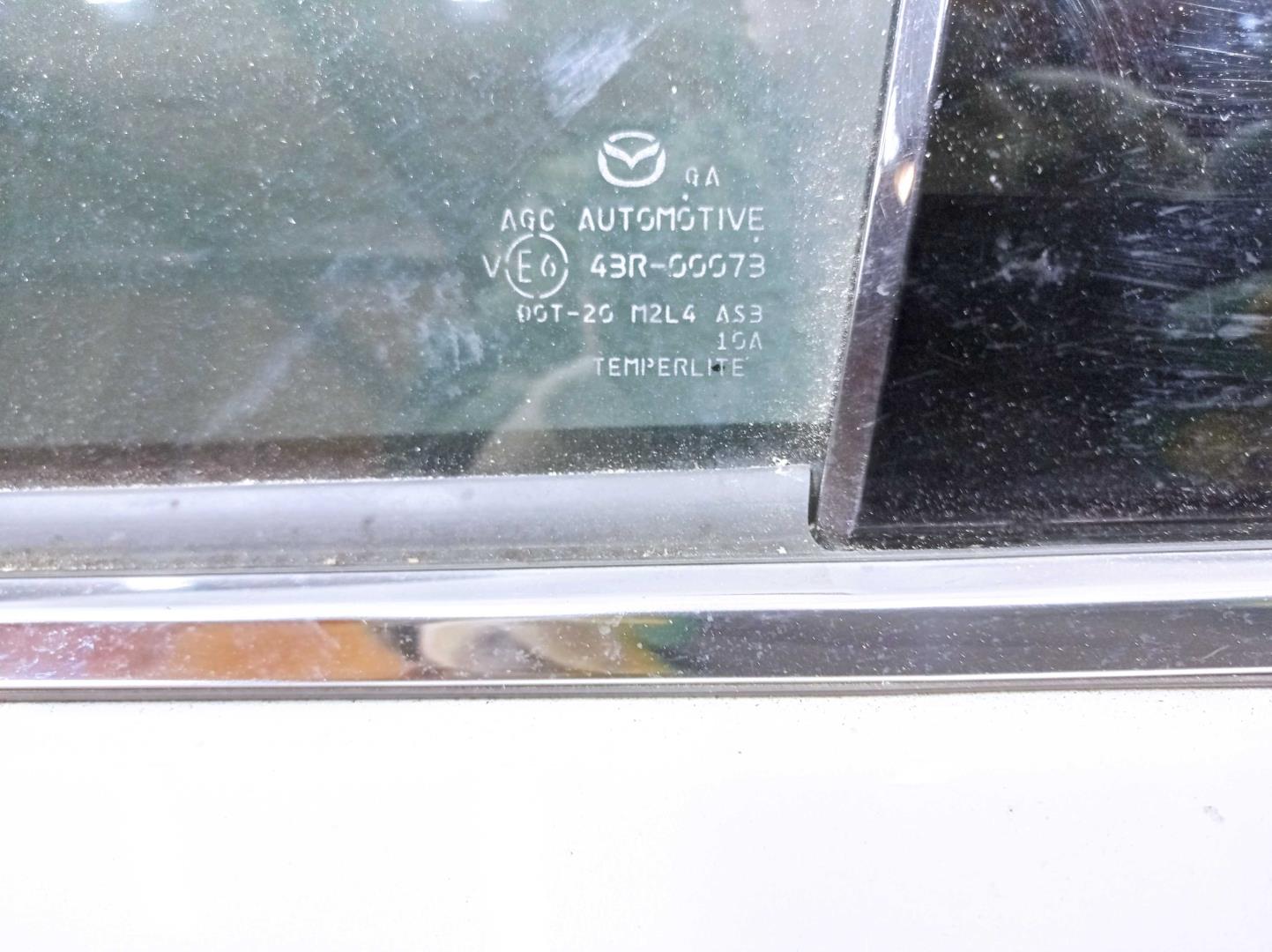 Стекло двери задней левой