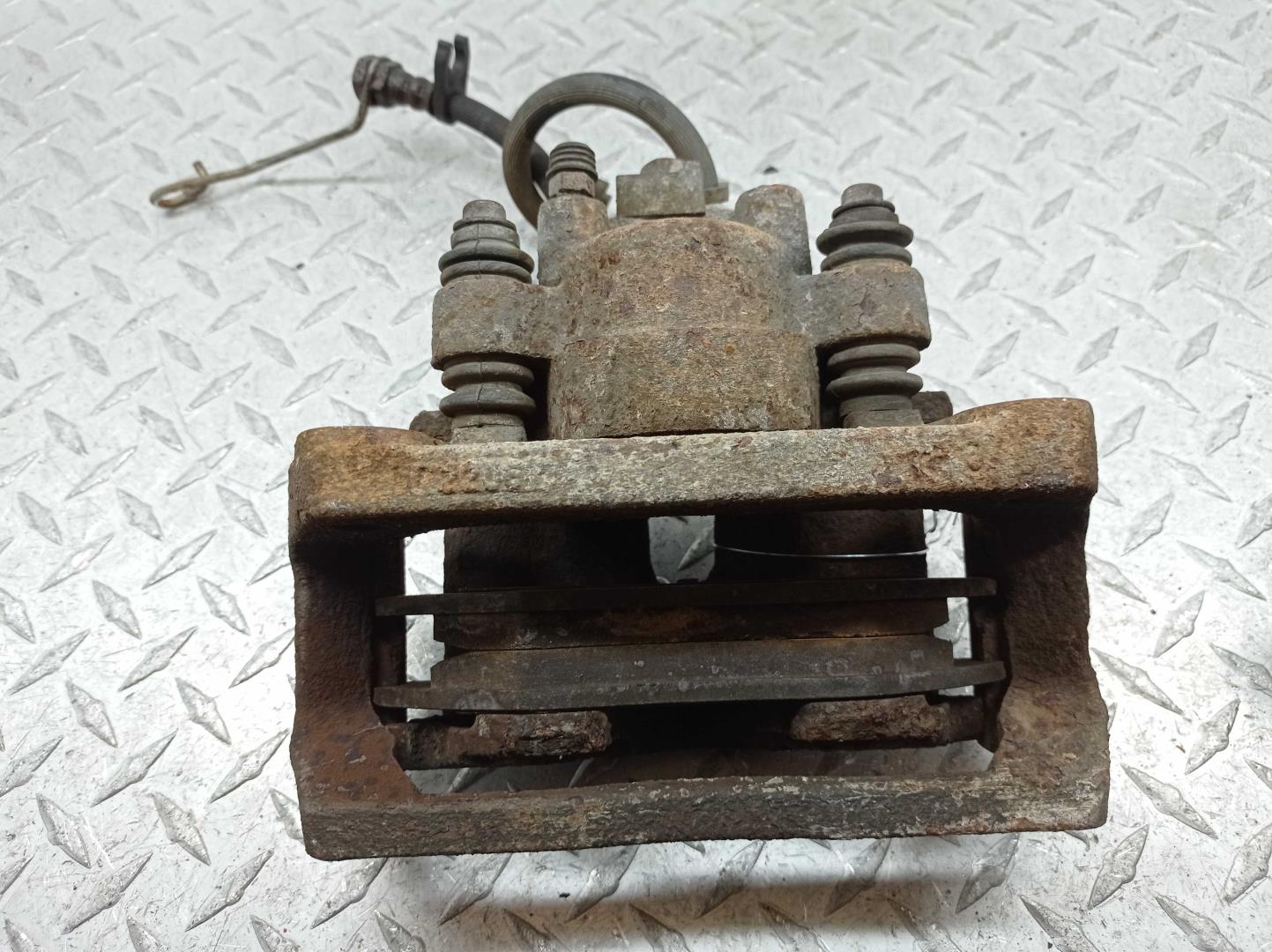 Суппорт задний левый