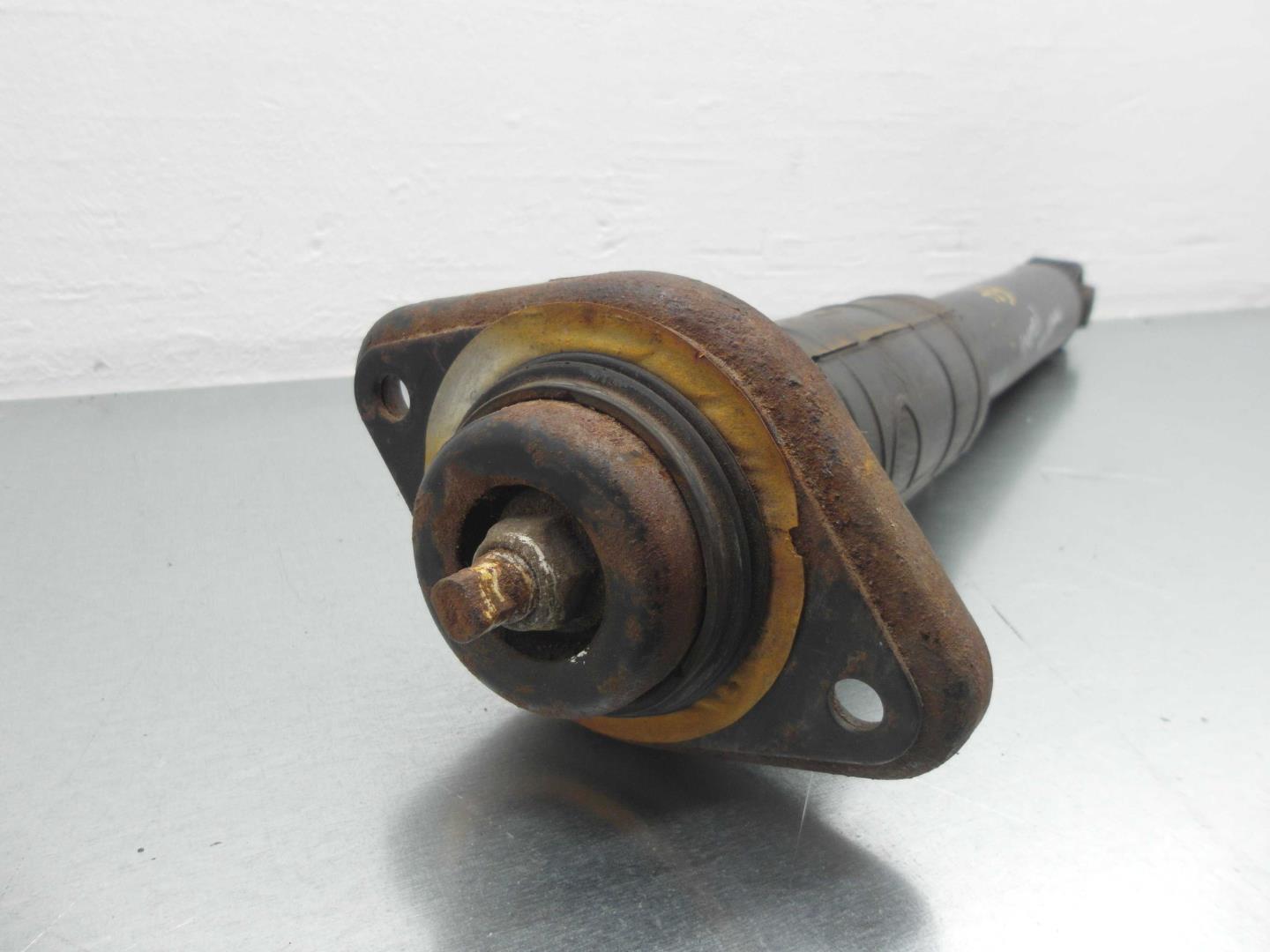 Амортизатор задний левый