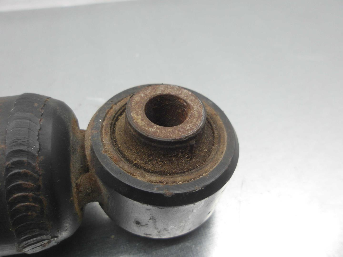 Амортизатор задний левый