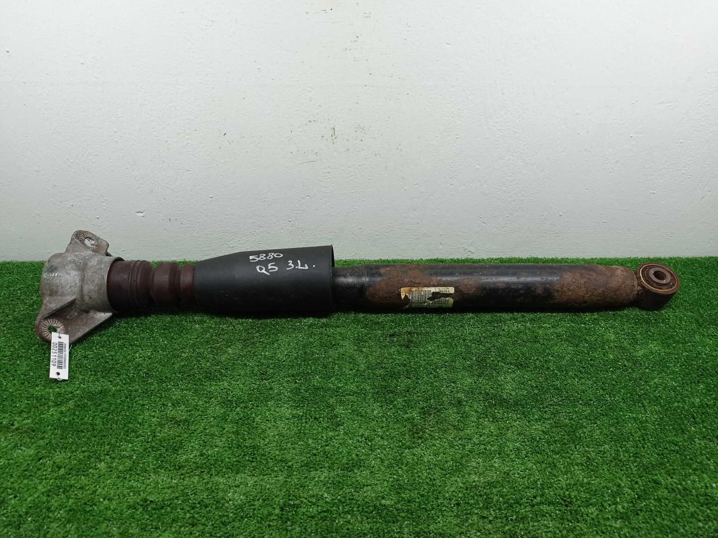 Амортизатор задний левый