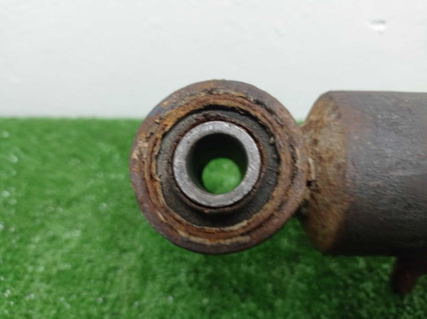 Амортизатор задний левый