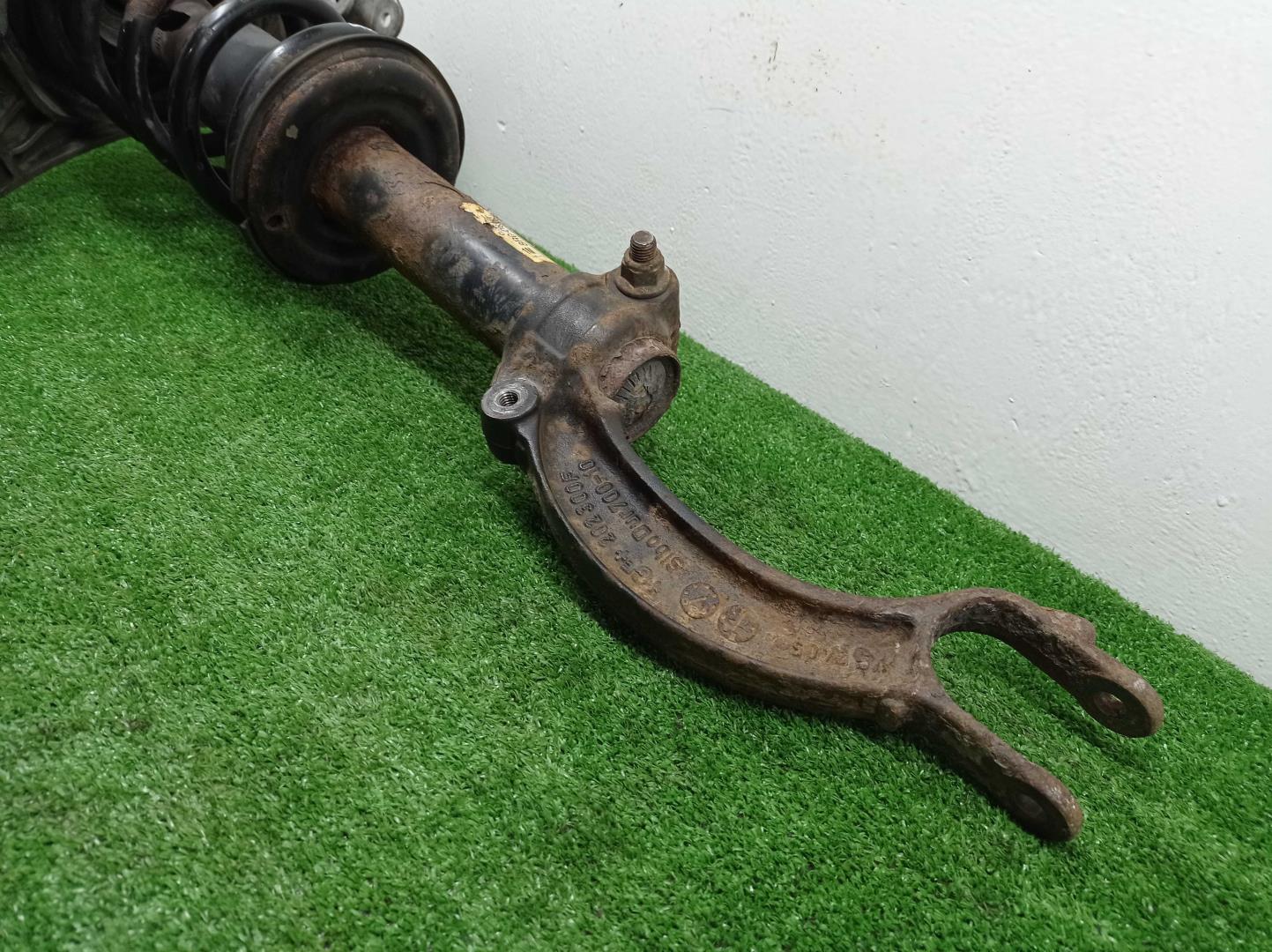 Амортизатор передний левый