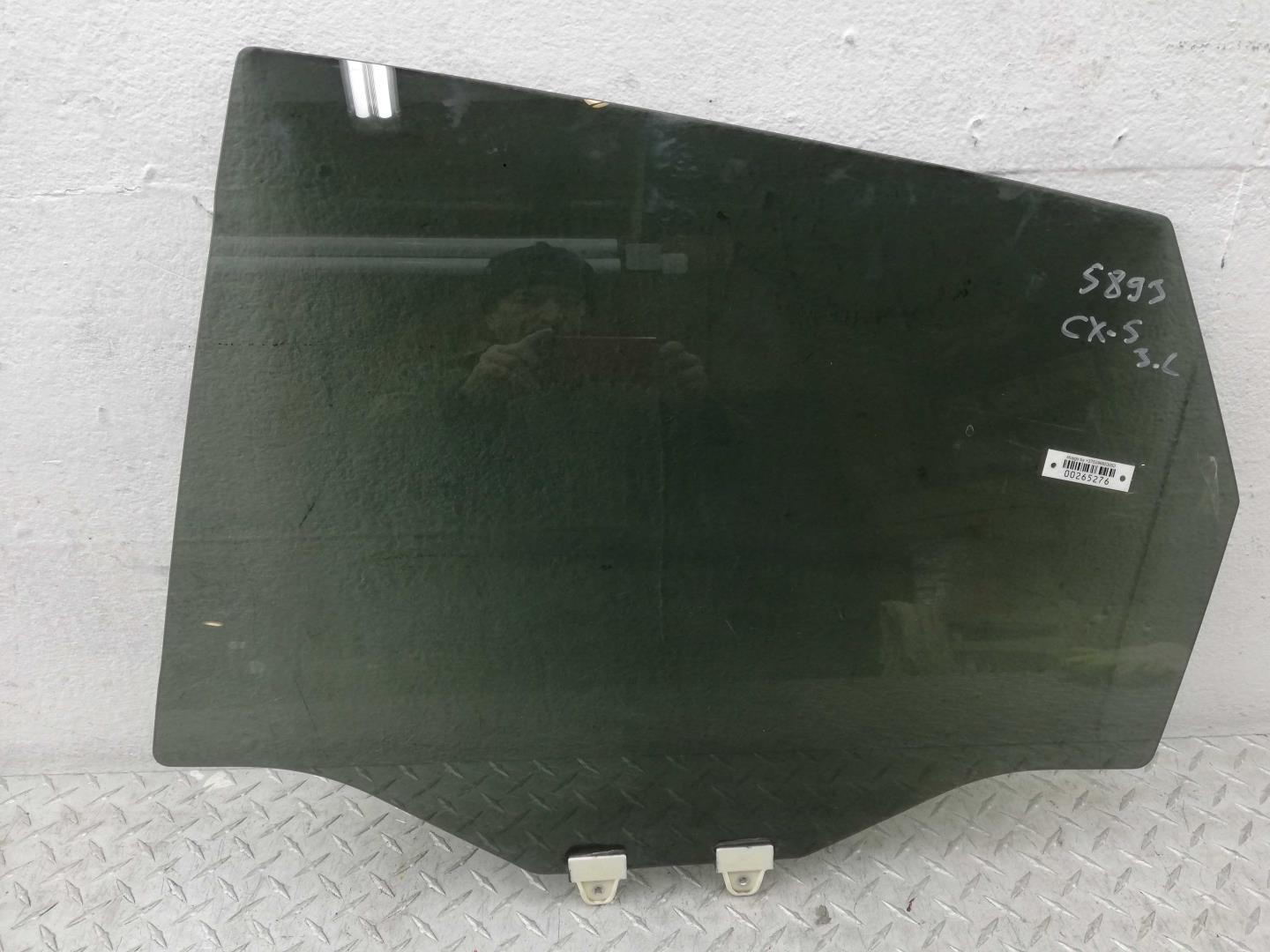 Стекло двери задней левой