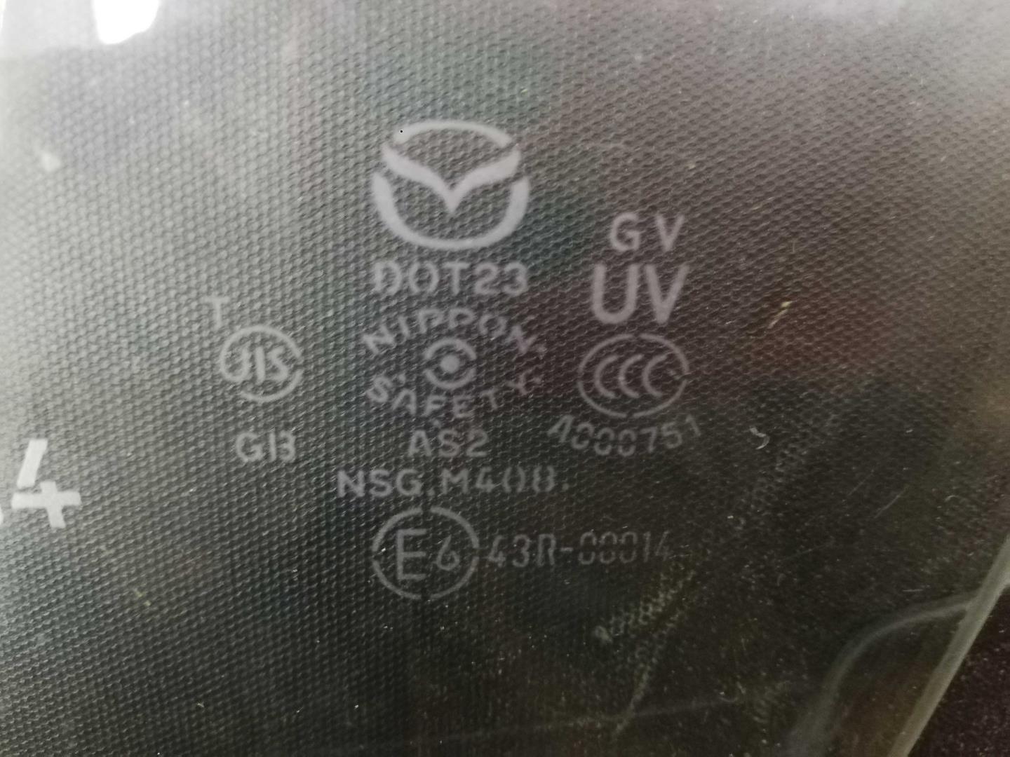 Стекло двери передней левой