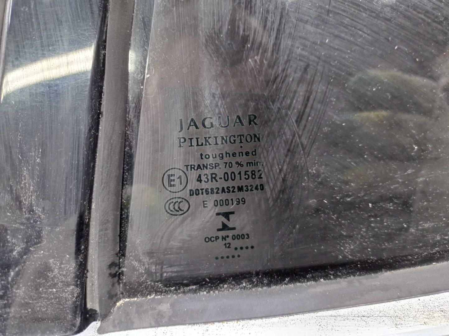 Стекло двери задней левой