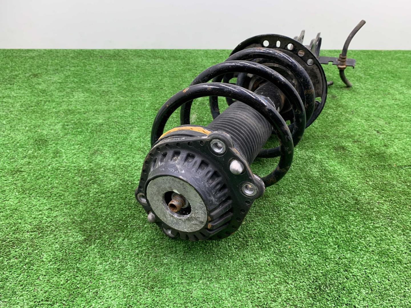 Амортизатор передний левый