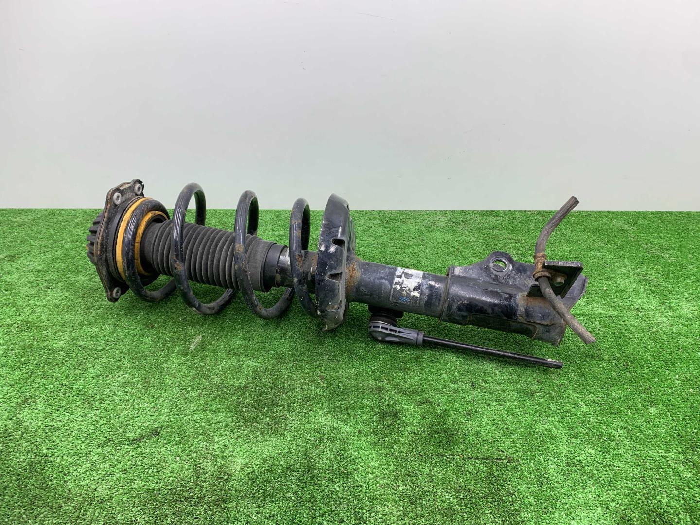 Амортизатор передний левый