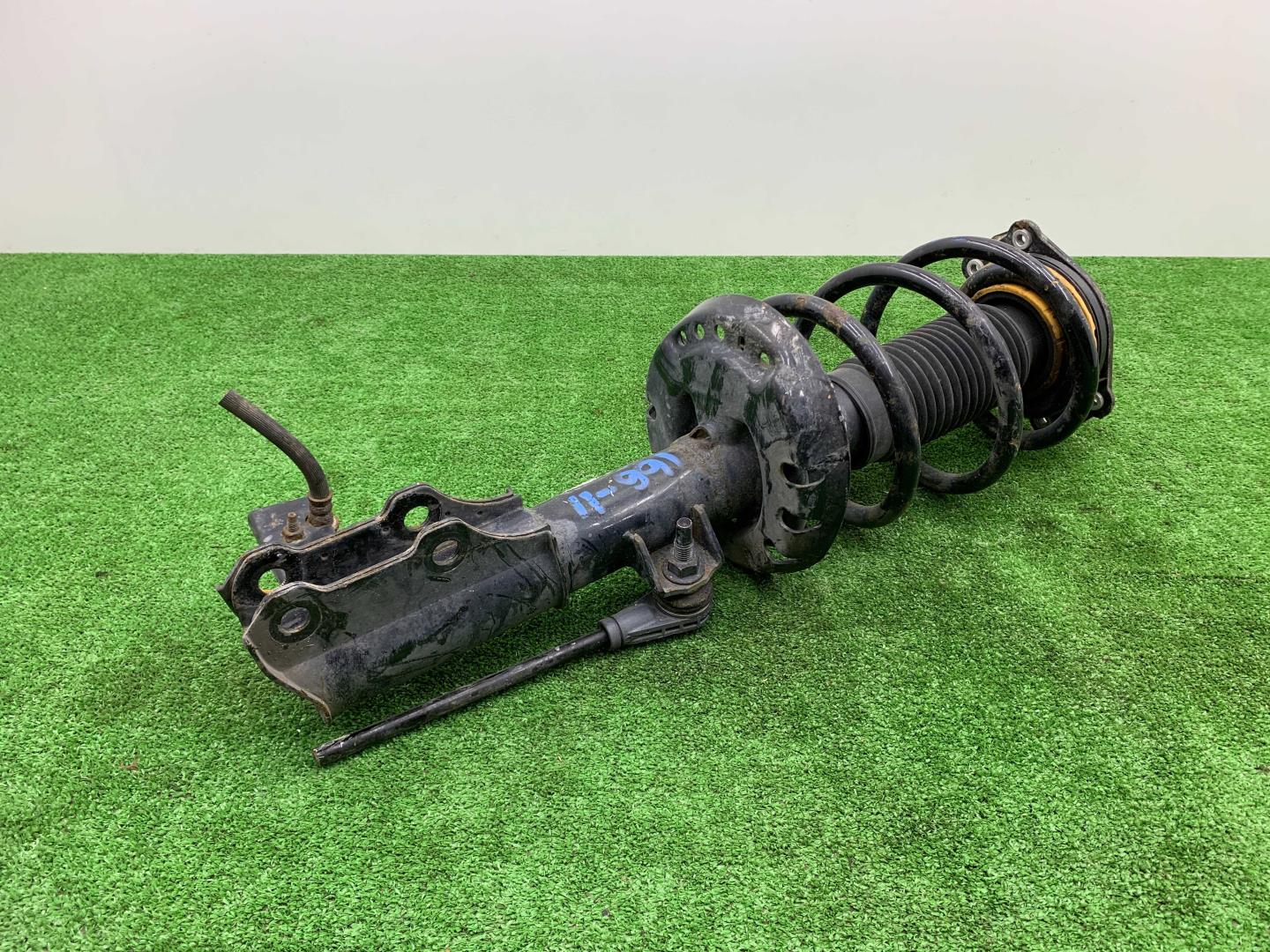 Амортизатор передний левый