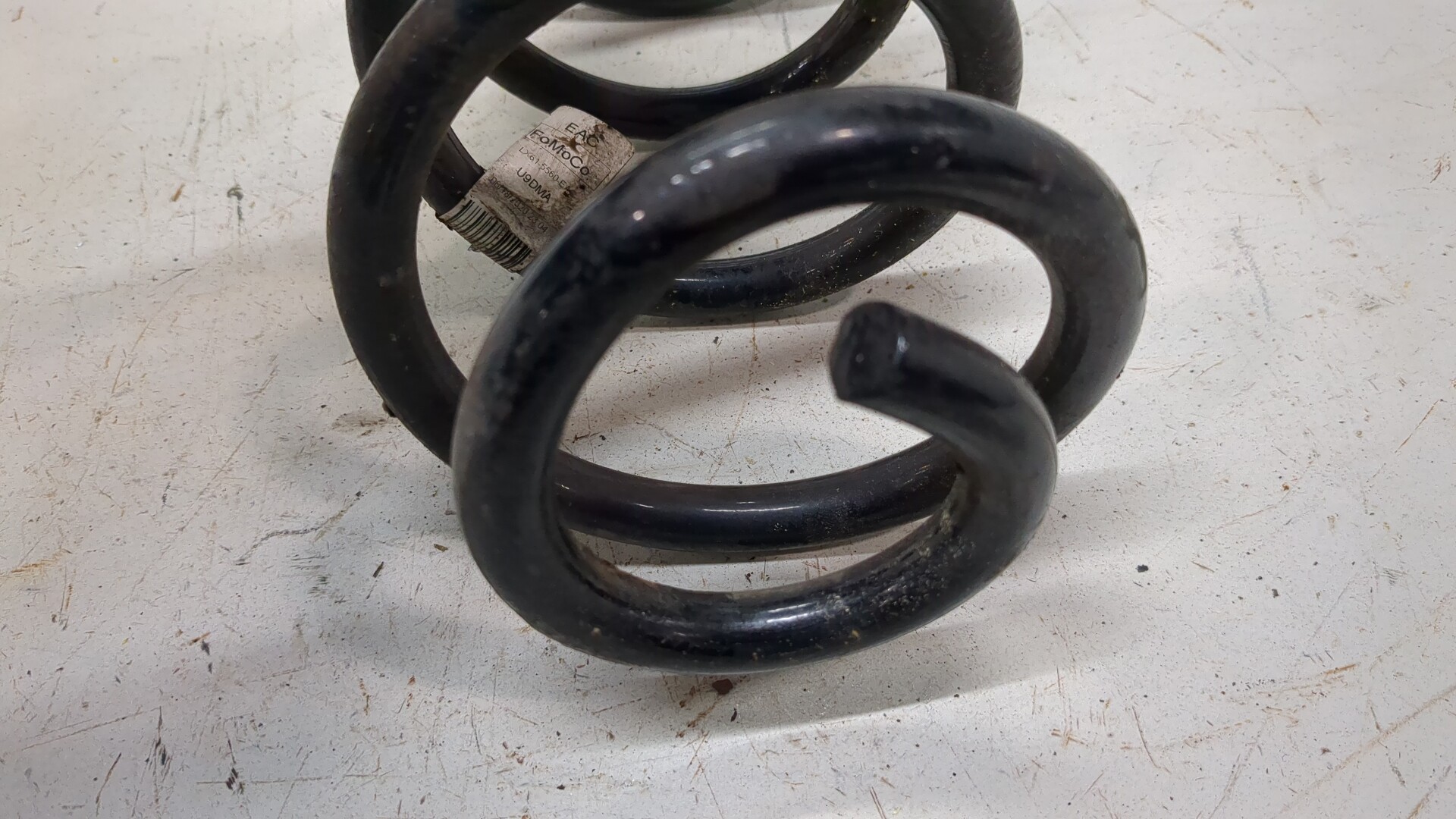 Пружина задняя