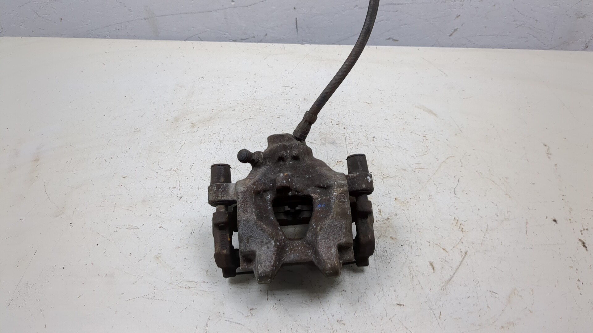 Суппорт задний левый