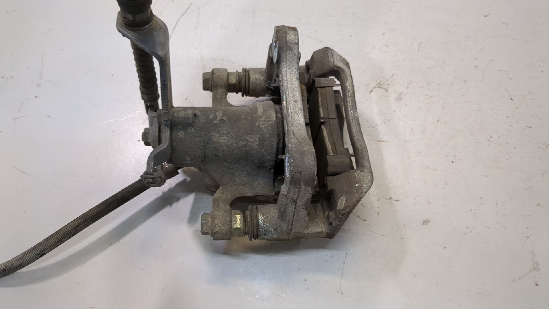 Суппорт задний левый