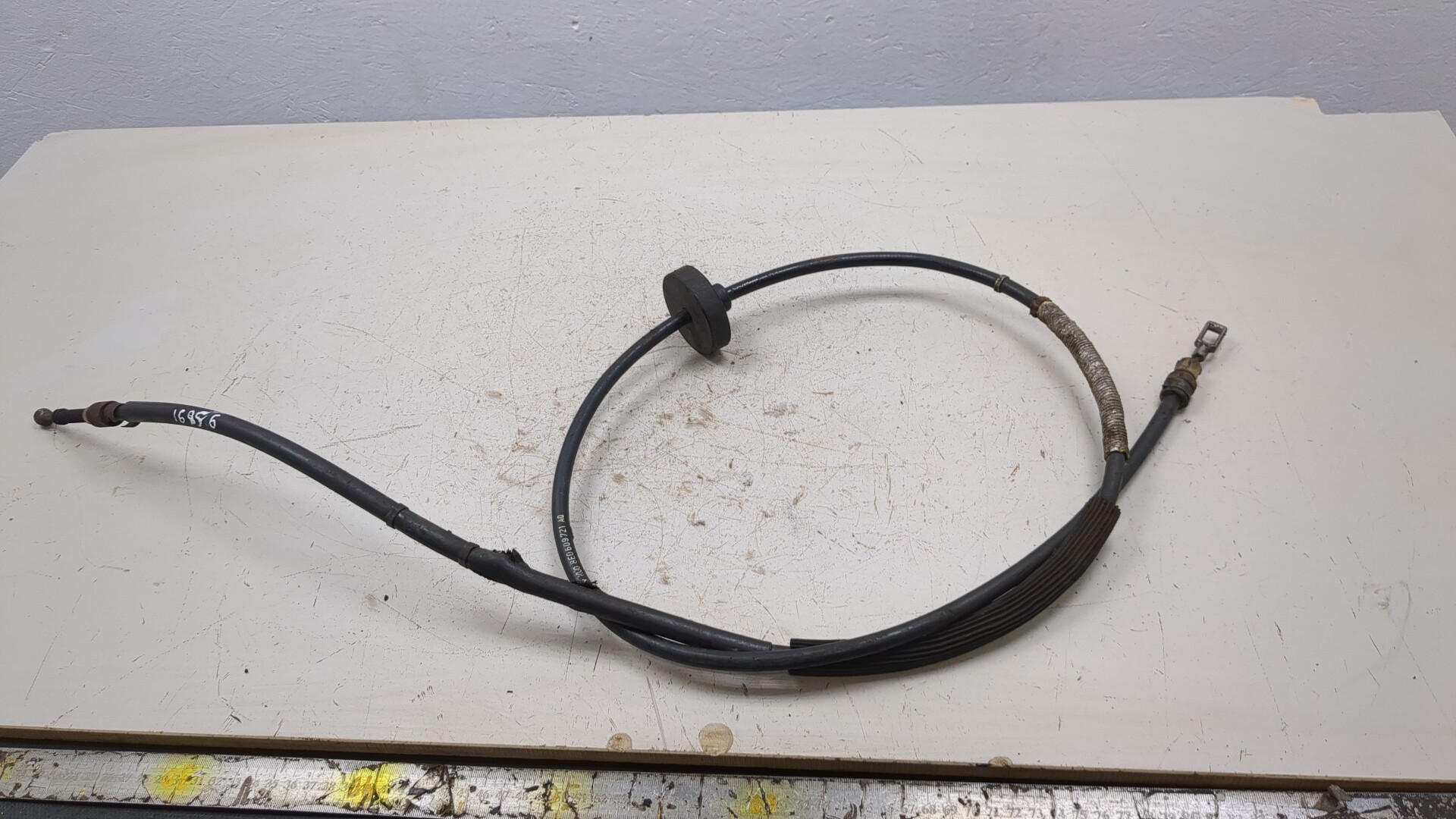 Трос стояночного тормоза