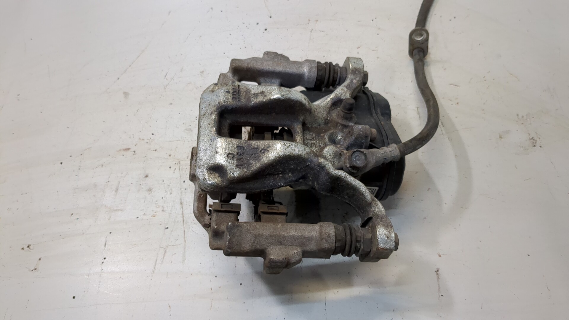 Суппорт задний левый