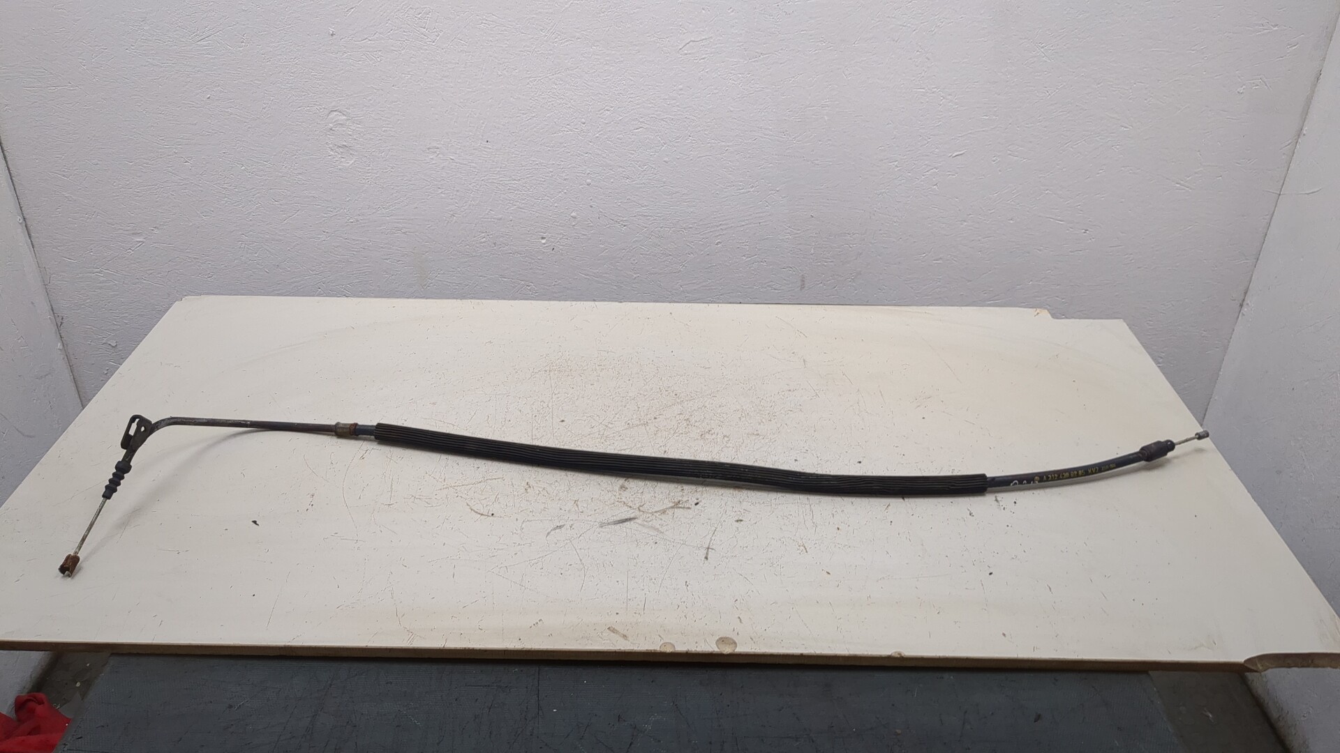 Трос стояночного тормоза