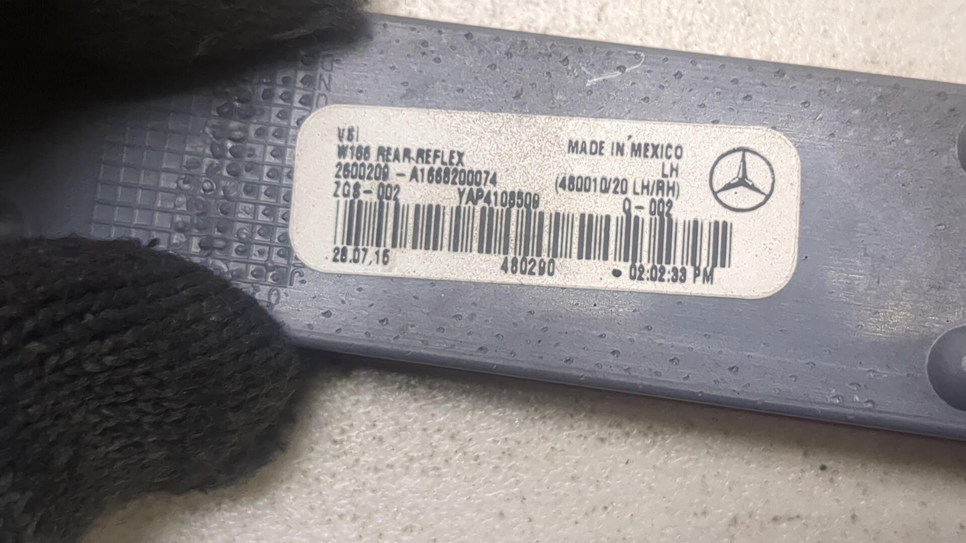 Отражатель в бампер задний левый